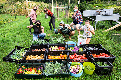 Students from FH King org showing off thier harvest