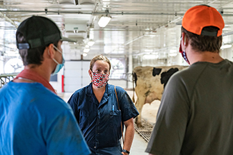 farmer talking to two other farmers